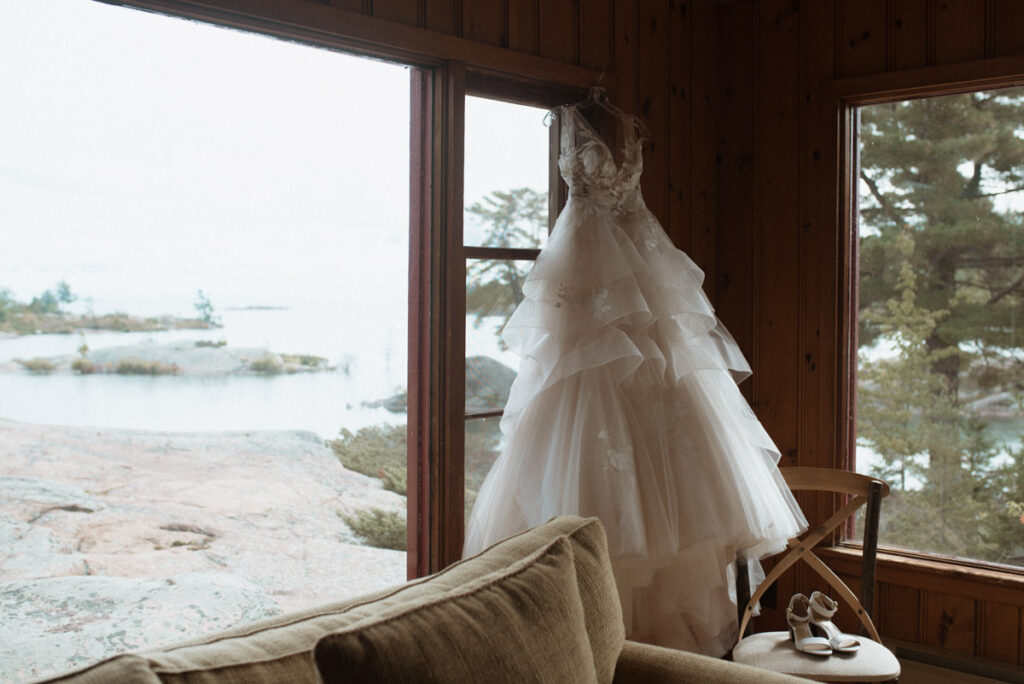 Killarney Mountain Lodge Wedding - dress hanging in window. 