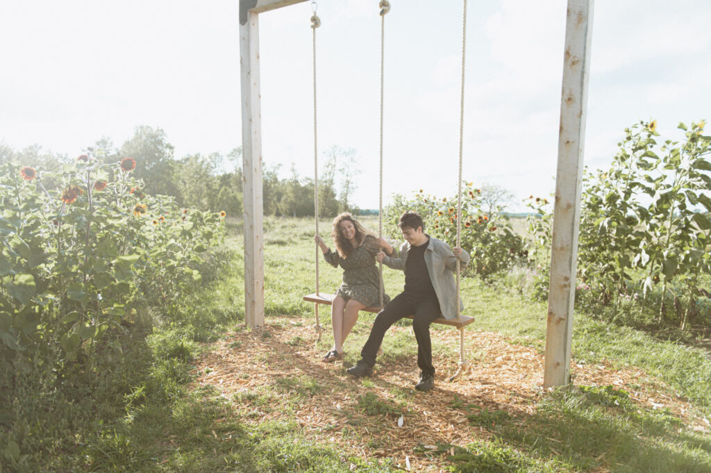 Manitoulin Island Engagement Photographer, Island Roots Flower Farm, Mindemoya, Ontario
Couple on a swing.