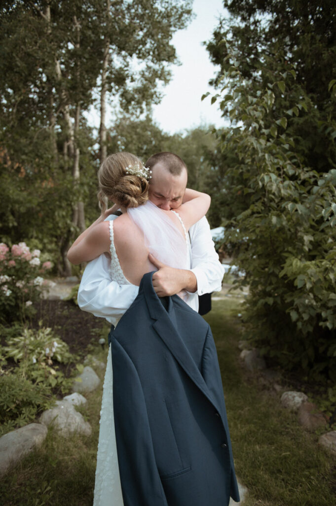 Sudbury Backyard Wedding bride hugging brother crying. 