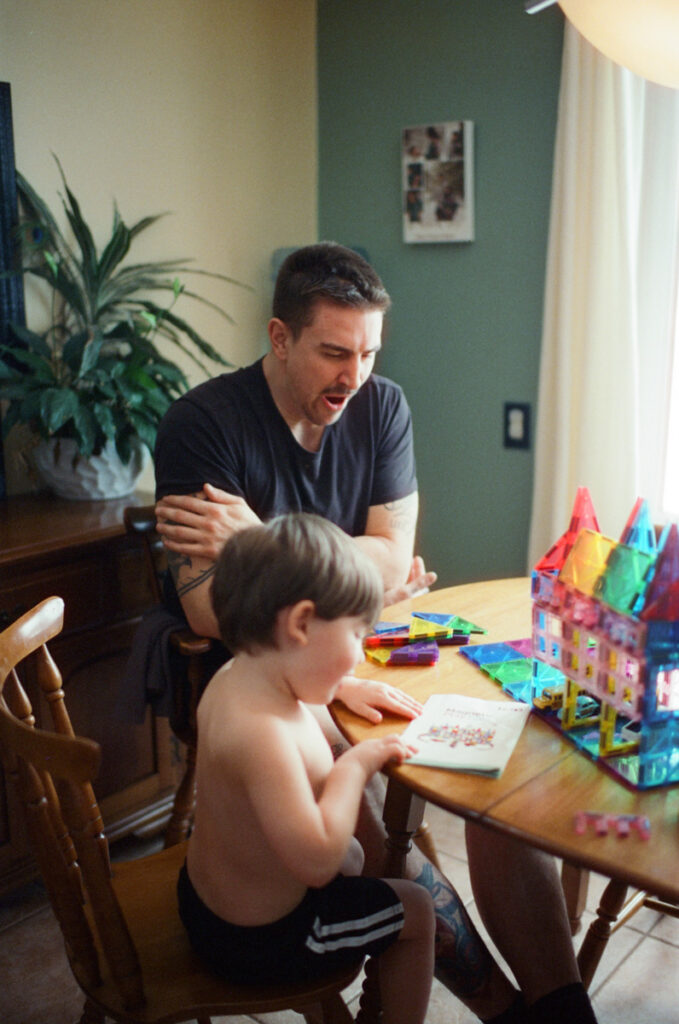Documentary-style image by Sudbury family photographer showing a candid family moment at home