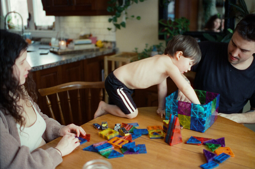 Documentary-style image by Sudbury family photographer showing a candid family moment at home