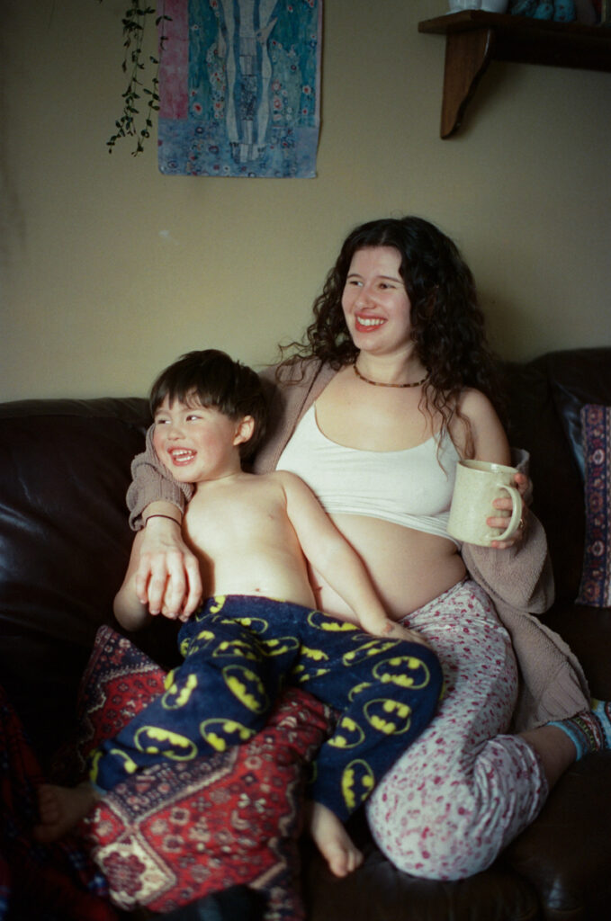 Documentary-style image by Sudbury family photographer showing a candid family moment at home