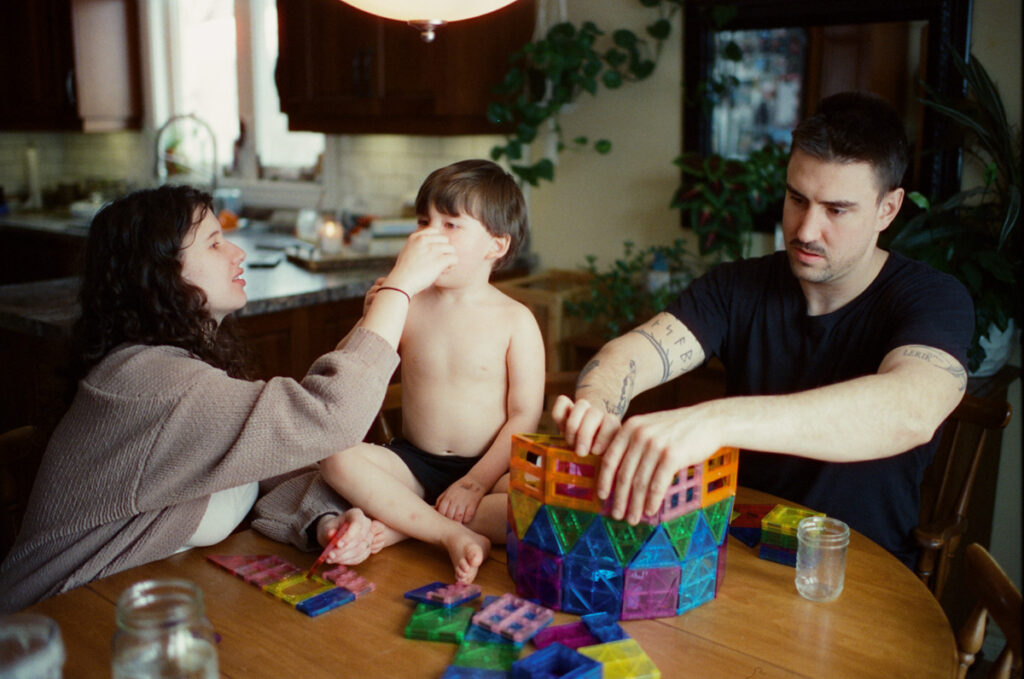 Documentary-style image showing a candid family moment at home