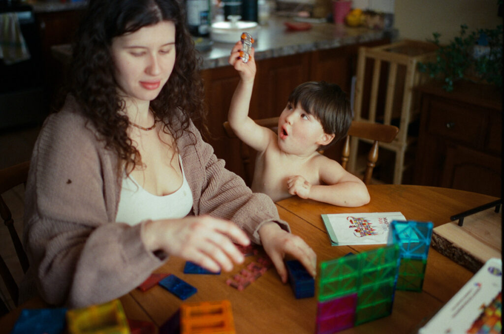 Documentary-style image by Sudbury family photographer showing a candid family moment at home