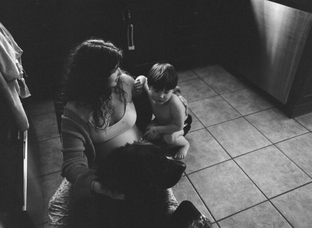 Documentary-style image by Sudbury family photographer showing a candid family moment at home