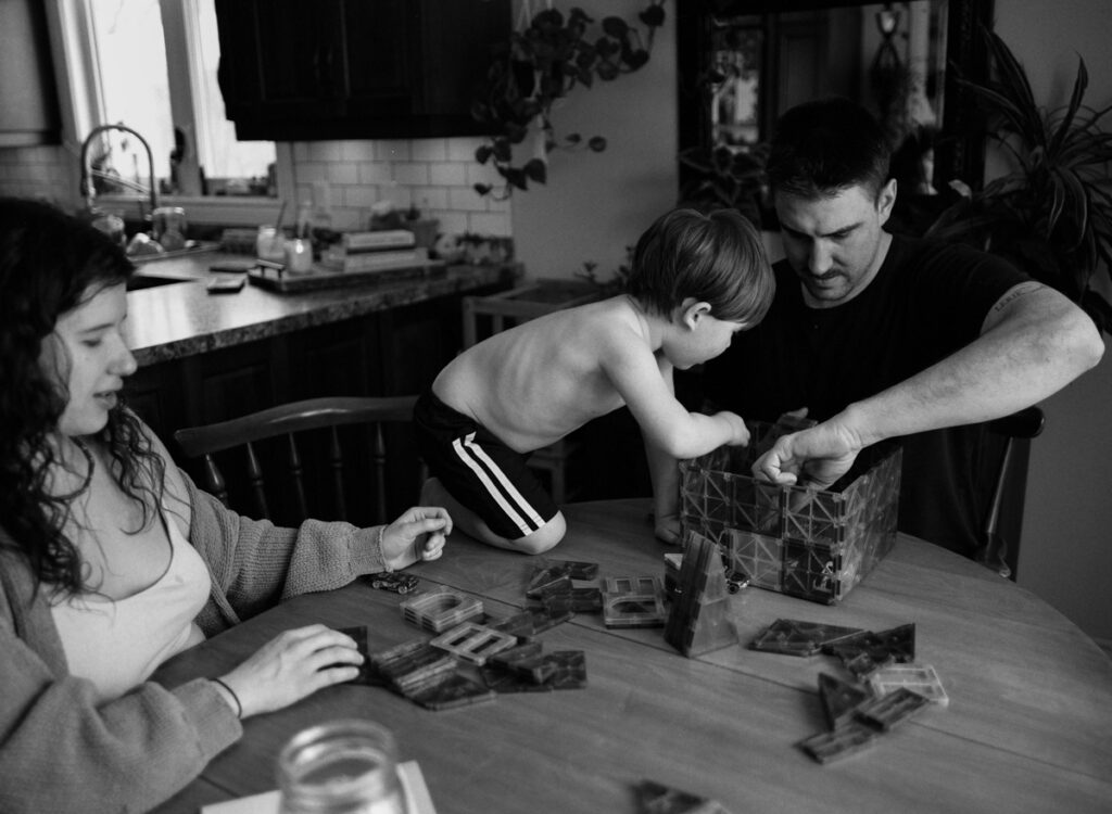 Documentary-style image by Sudbury family photographer showing a candid family moment at home