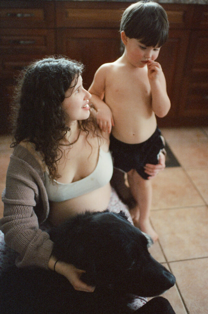 Documentary-style image by Sudbury family photographer showing a candid family moment at home