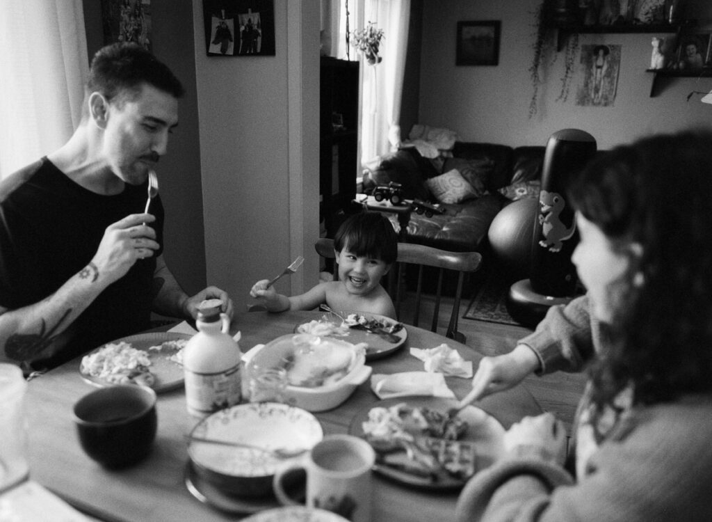 Documentary-style image by Sudbury family photographer showing a candid family moment at home