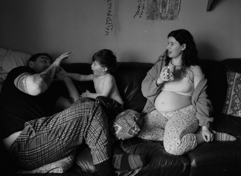 Documentary-style image by Sudbury family photographer showing a candid family moment at home