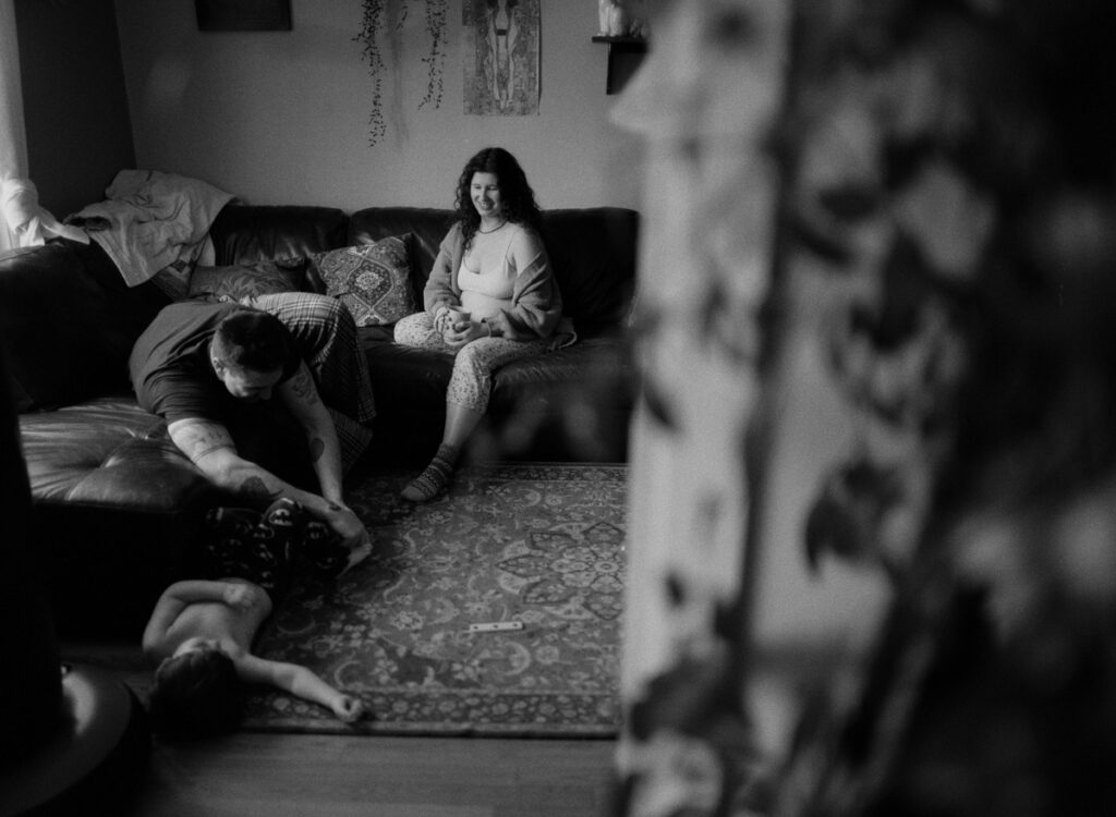 Documentary-style image by Sudbury family photographer showing a candid family moment at home