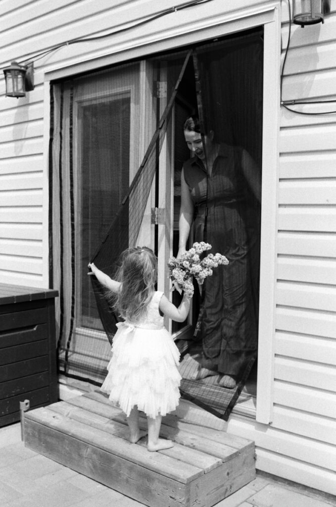 family outside in the sun, documented by a Sudbury Family Photographer