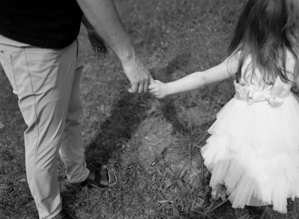 family outside in the sun, documented by a Sudbury Family Photographer